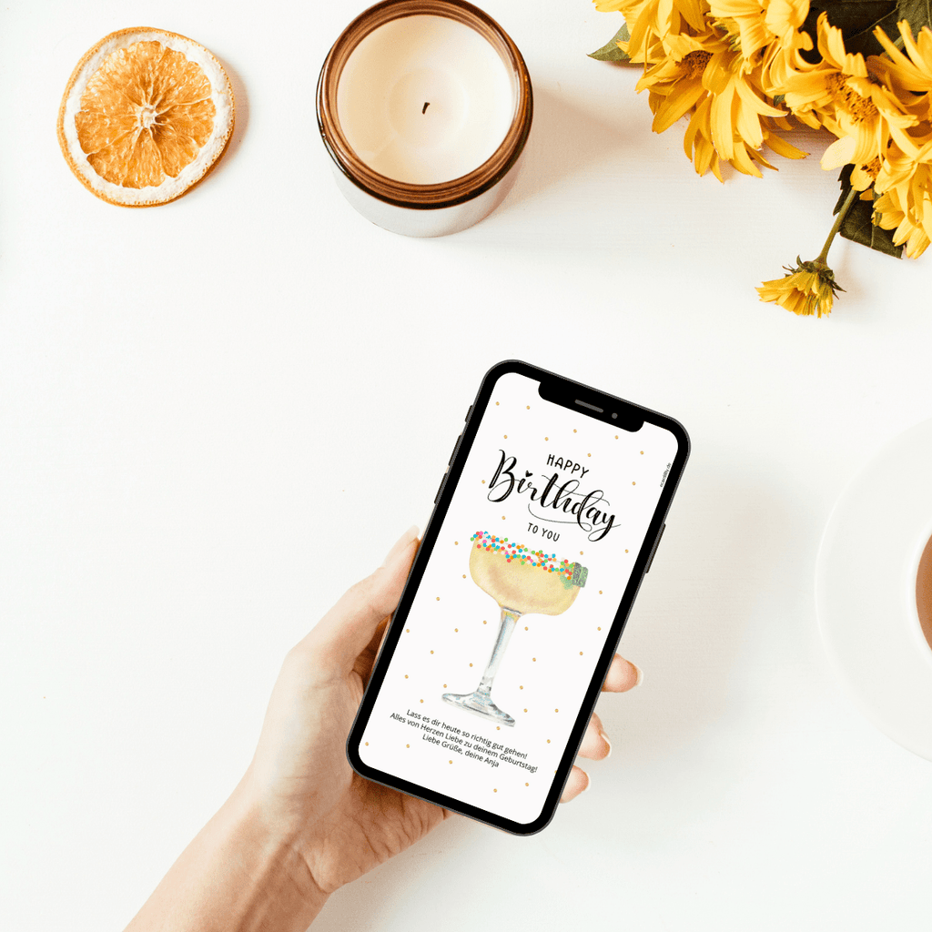 Digitale Grußkarte zum Geburtstag mit einem Cocktail und bunten Perlen.