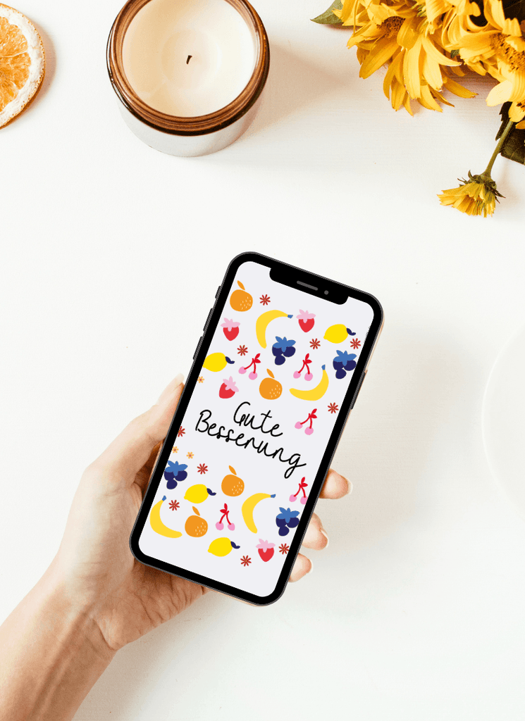 Digitale Grußkarte zur guten Besserung mit einem Herz und viel Obst in bunten Farben. Fühl dich von Herzen gedrückt in der Corona-Zeit de